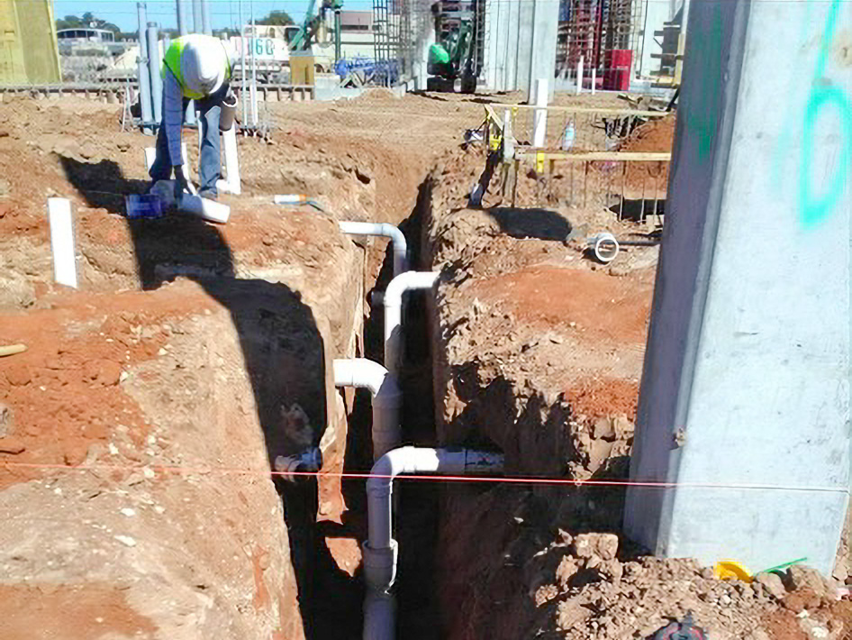 UT Company technicians working on plumbing installations at the Odessa Marriott Hotel.